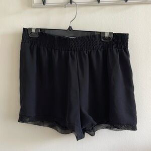 Black high-waisted shorts with mesh trim